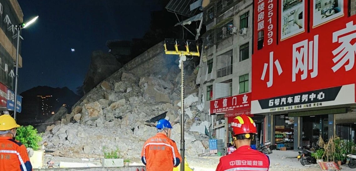 Light tower illuminating a night-time landslide emergency response