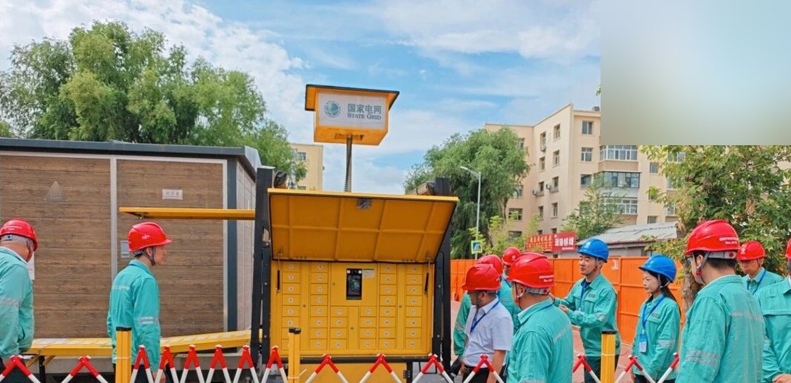 Crew inspecting mobile power equipment before an event